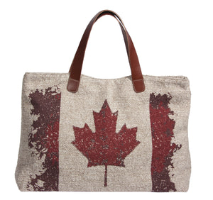 This L994-Canad Traveller Tote 23"x13"x6" with Bridle Leather straps, Designed and Printed on a Textured Fabric with the Vintage Canada Flag on one side, part of the Lady Rosedale Vintage Canadiana Collection