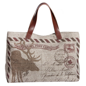 This L994-POST Traveller Tote 23"x13"x6" with Bridle Leather straps, Designed and Printed on a Textured Fabric with the Vintage Canada Flag on one side, part of the Lady Rosedale Vintage Canadiana Collection